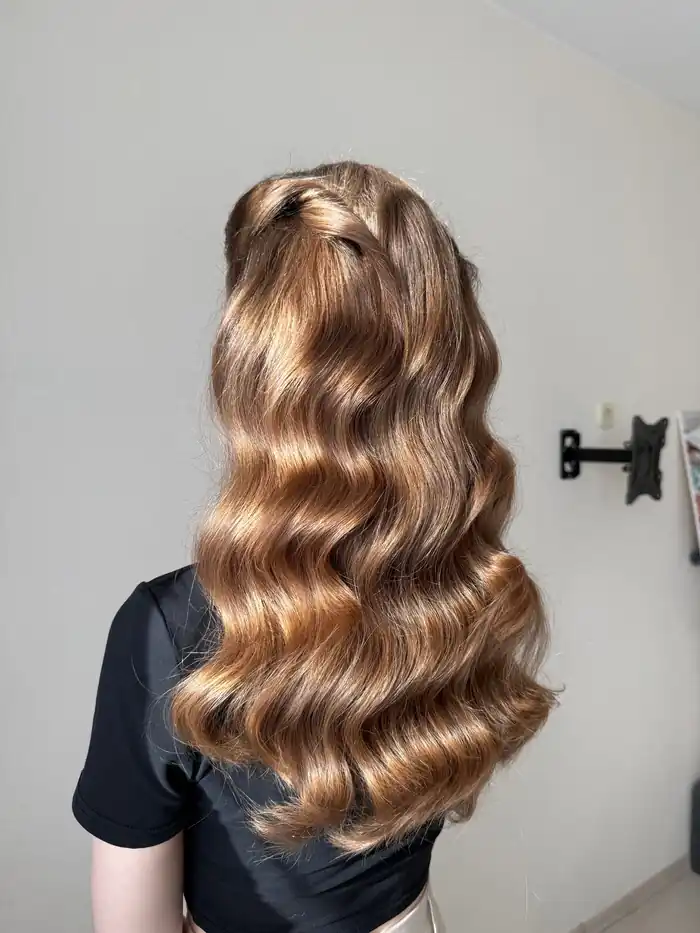 Glossy blow-dried hair after a cut and colour